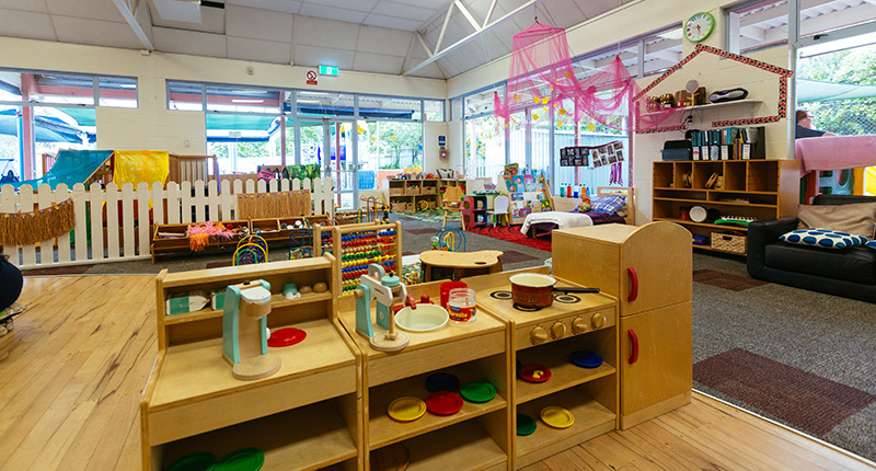 howick childcare room with toys and play wooden kitchen and appliances