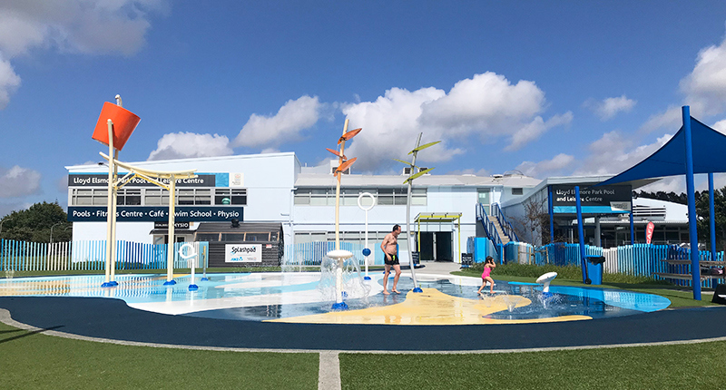 exterior view of the lloyd elsmore pool and splash pad in the foreground