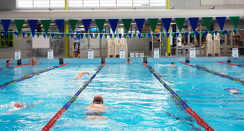 Lloyd Elsmore pool with swimmers and flags