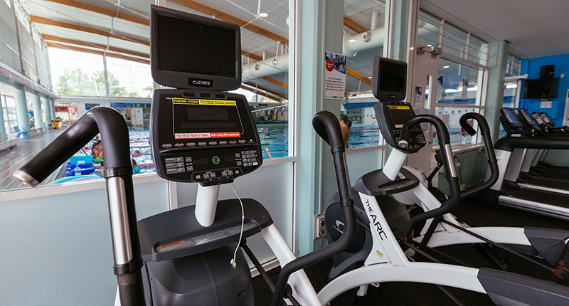 close up of treadmills overlooking the pool hall