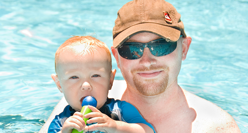 father and son in water