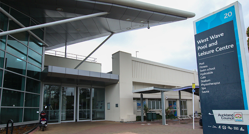 West wave entrance exterior with signage