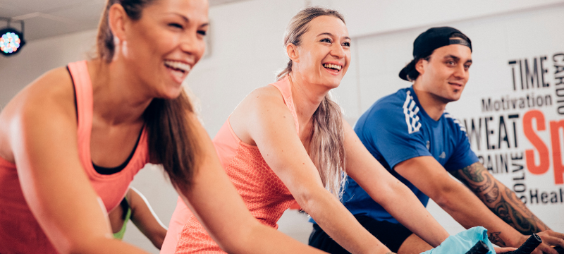 people smiling while exercising as a group